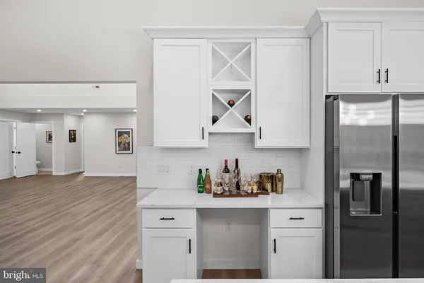 a kitchen with stainless steel appliances a sink stove and cabinets