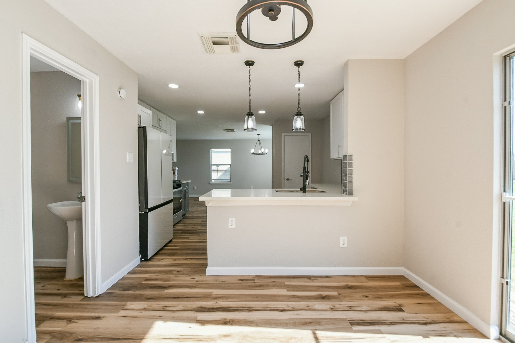 20807 Lansing Ridge Lane Katy, TX 77449 - Photo 15 of 35 a view of a hallway with wooden floor and staircase