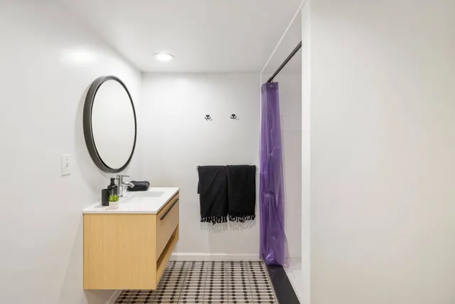a bathroom with a sink and a mirror