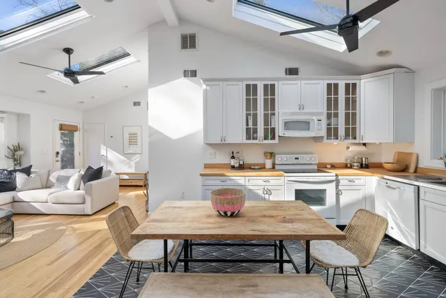 a kitchen with a table and chairs in it