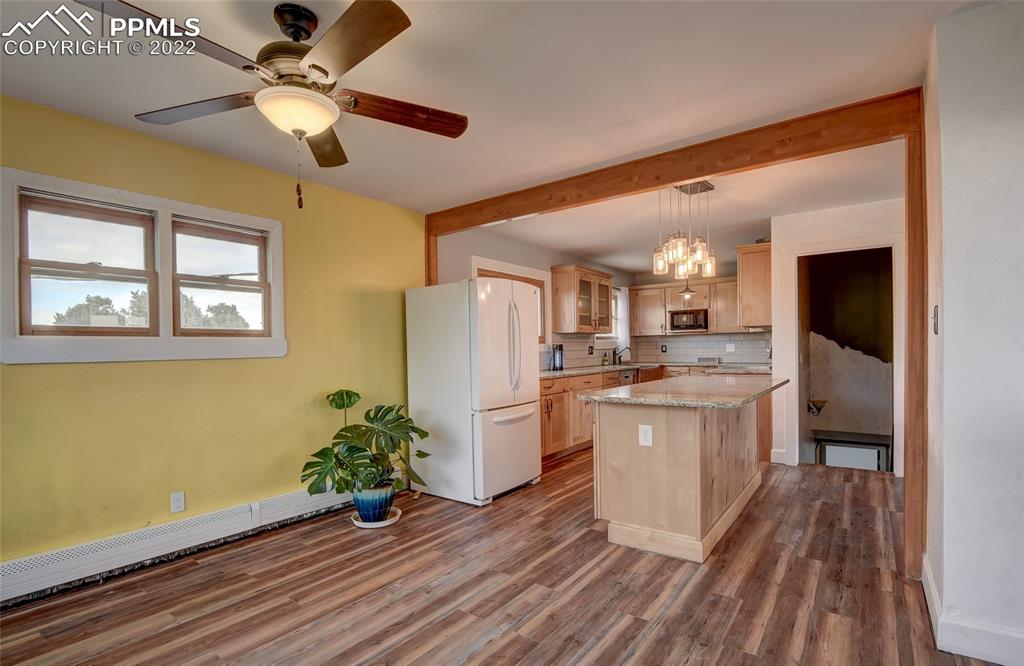 37550 Highway 94 Yoder, CO 80864 - Photo 14 of 39 a kitchen with a refrigerator and a sink