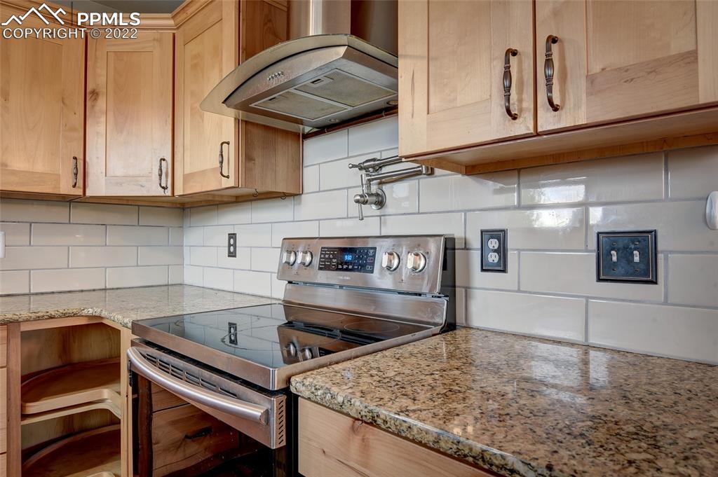 37550 Highway 94 Yoder, CO 80864 - Photo 17 of 39 a kitchen with stainless steel appliances granite countertop a sink and cabinets
