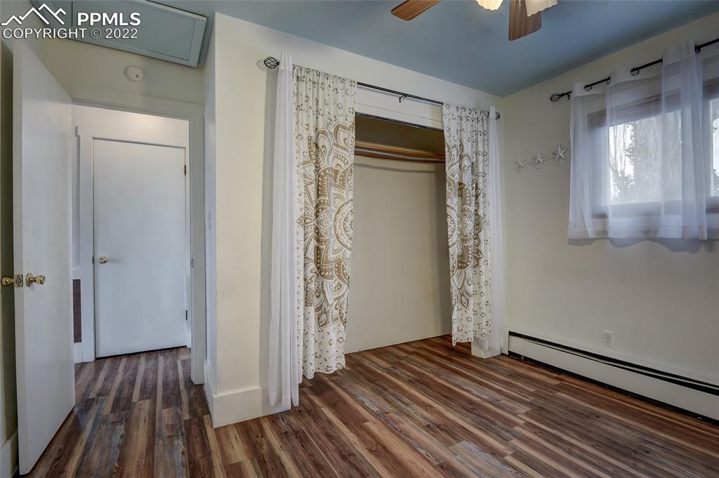 37550 Highway 94 Yoder, CO 80864 - Photo 22 of 39 a view of a livingroom with wooden floor and staircase