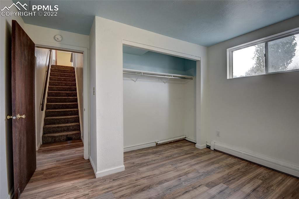 37550 Highway 94 Yoder, CO 80864 - Photo 25 of 39 wooden floor in an empty room