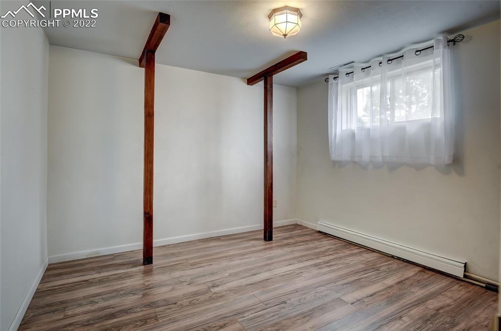 37550 Highway 94 Yoder, CO 80864 - Photo 27 of 39 a view of an empty room with wooden floor and a window