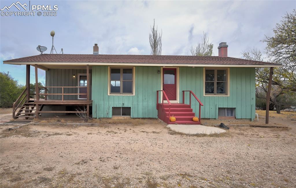 37550 Highway 94 Yoder, CO 80864 - Photo 3 of 39 a front view of a house with a yard