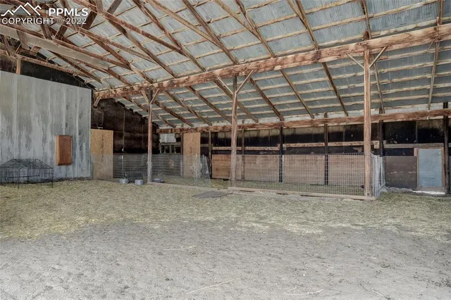 a view of an empty room with a wooden roof
