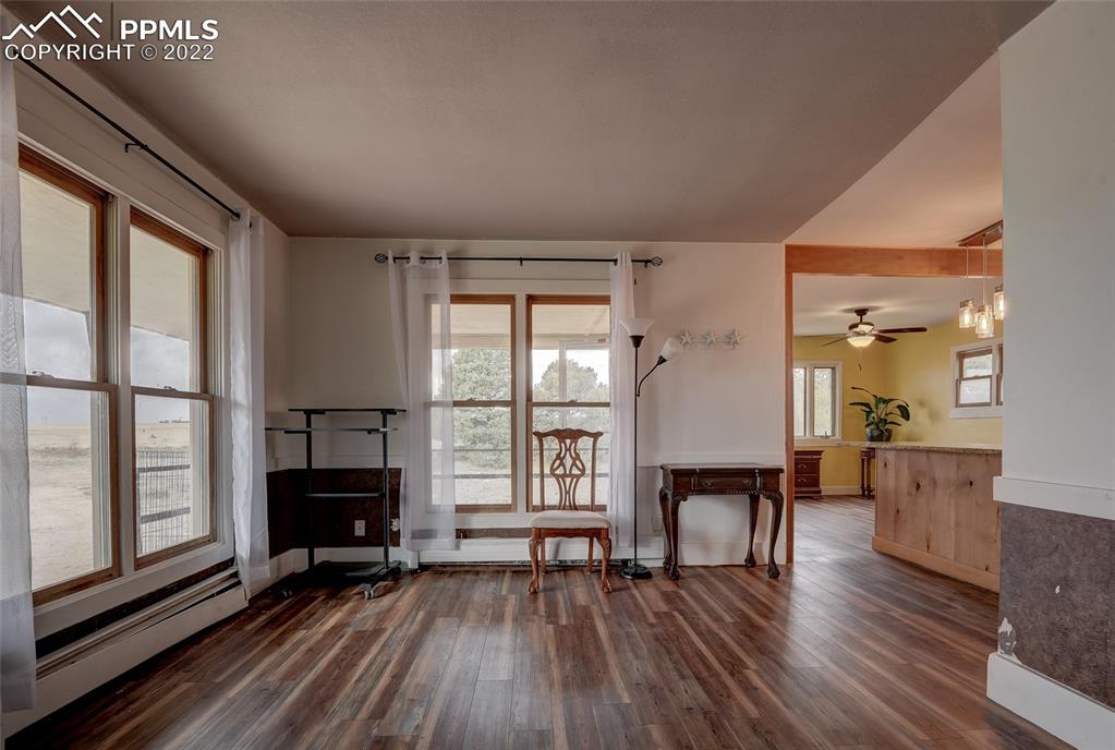 37550 Highway 94 Yoder, CO 80864 - Photo 8 of 39 a view of a livingroom with furniture and a fireplace