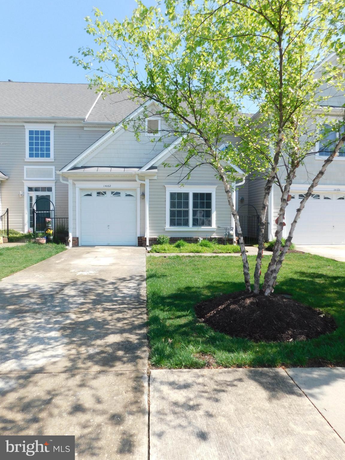 14162 Foxhall Road, Unit 4 Dowell, MD 20629 - Photo 1 of 24 a front view of a house with garden