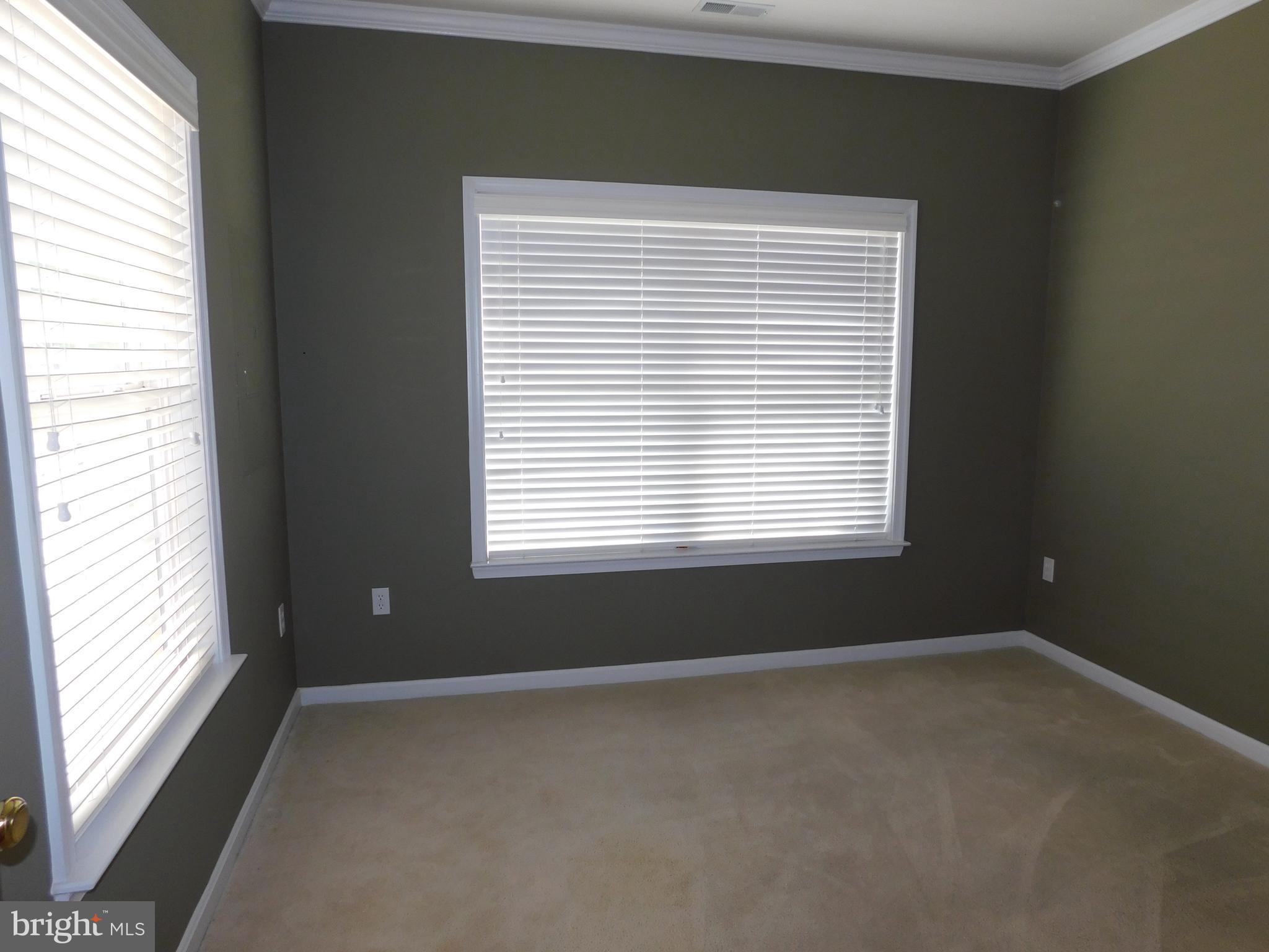 14162 Foxhall Road, Unit 4 Dowell, MD 20629 - Photo 9 of 24 a view of a room that has a window in it