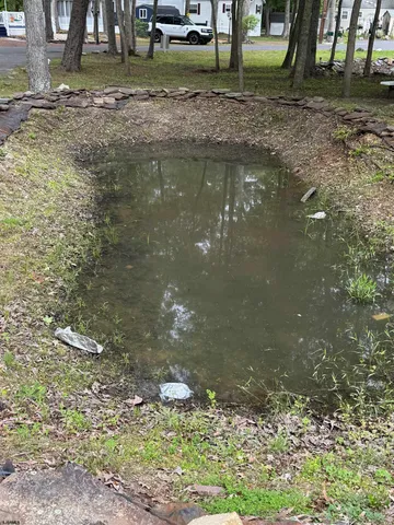 a view of a backyard with sitting area
