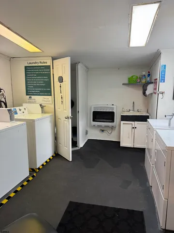 a view of a swimming pool and trees in the background