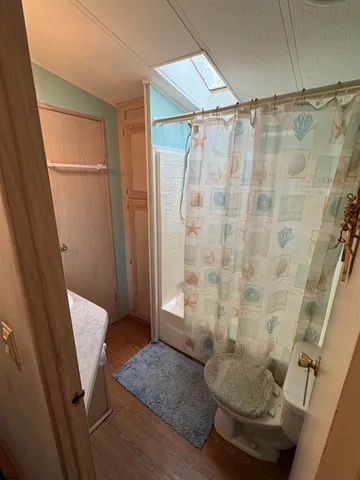 a bedroom with a bed lamps and a stove