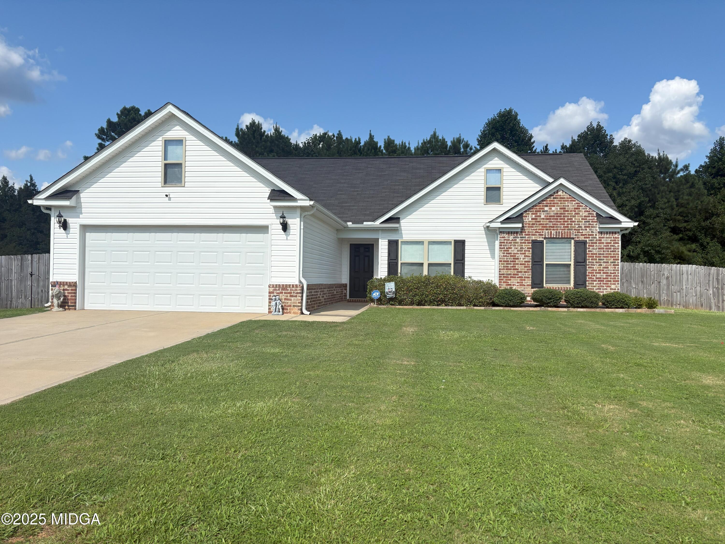 837 Weldon Road Forsyth, GA 31029 - Photo 1 of 24 a front view of house with yard and green space