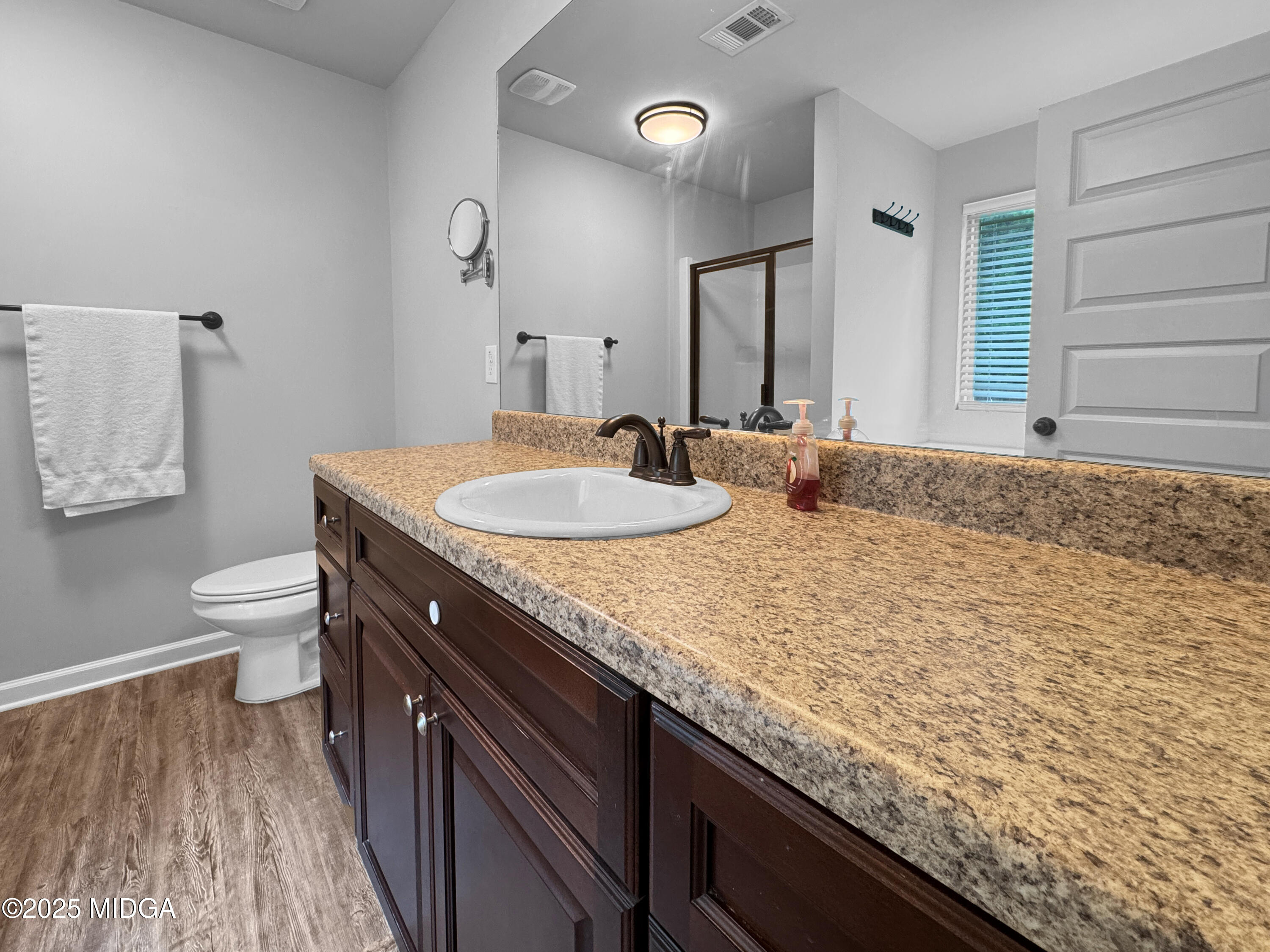 837 Weldon Road Forsyth, GA 31029 - Photo 15 of 24 a bathroom with a granite countertop double vanity sink and a mirror