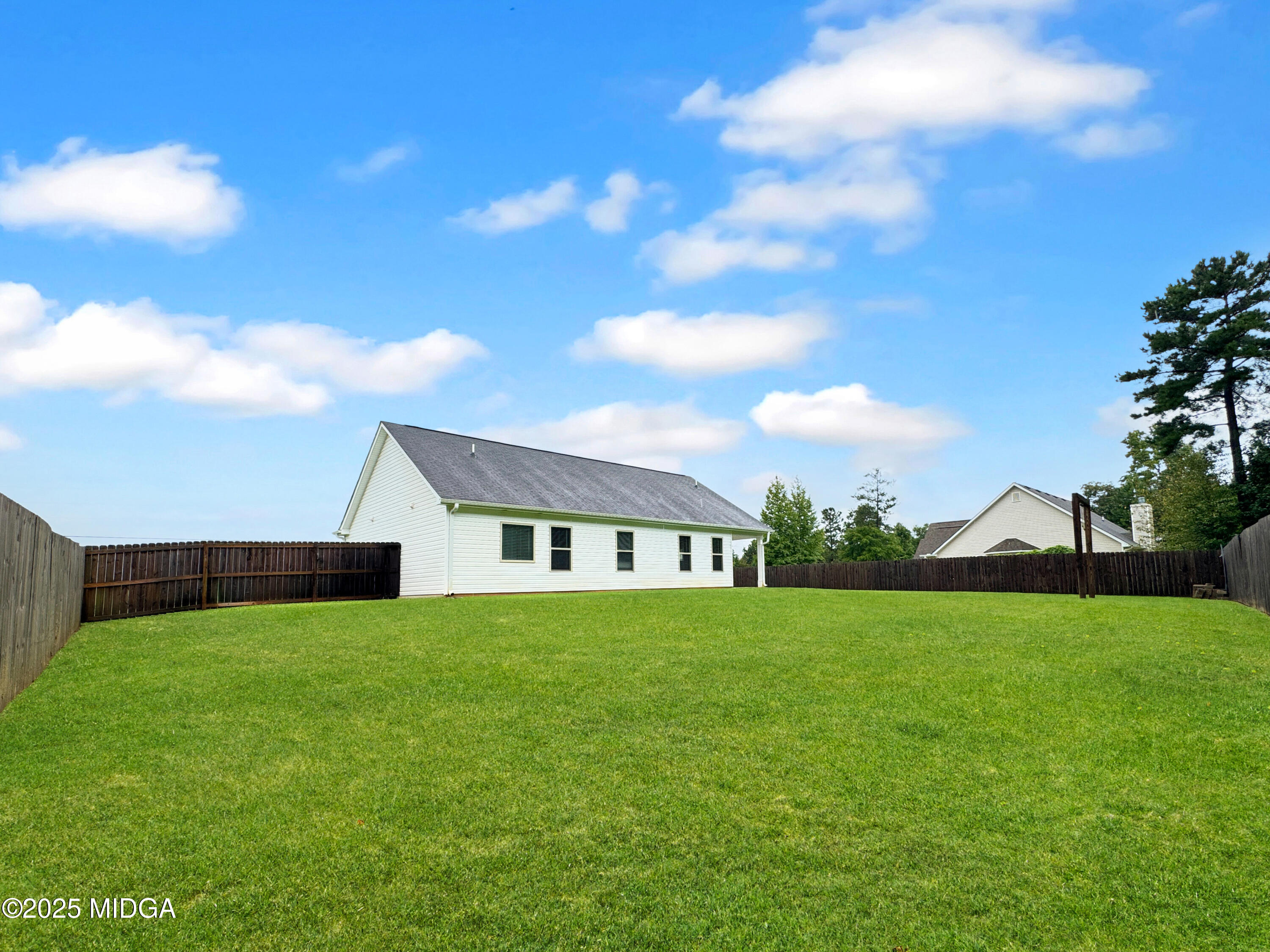 837 Weldon Road Forsyth, GA 31029 - Photo 20 of 24 a view of an house with backyard and garden