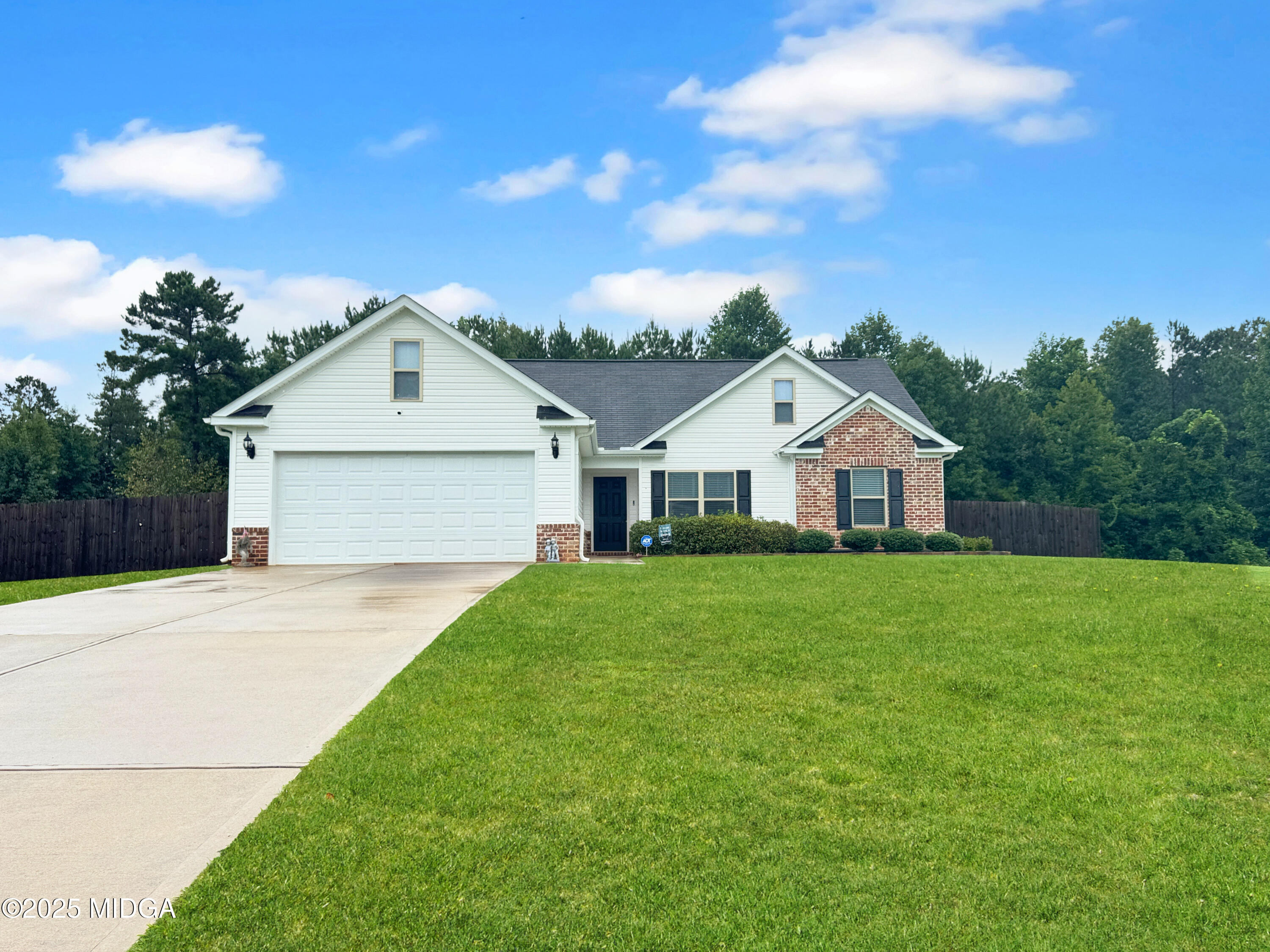837 Weldon Road Forsyth, GA 31029 - Photo 2 of 24 a front view of a house with a yard