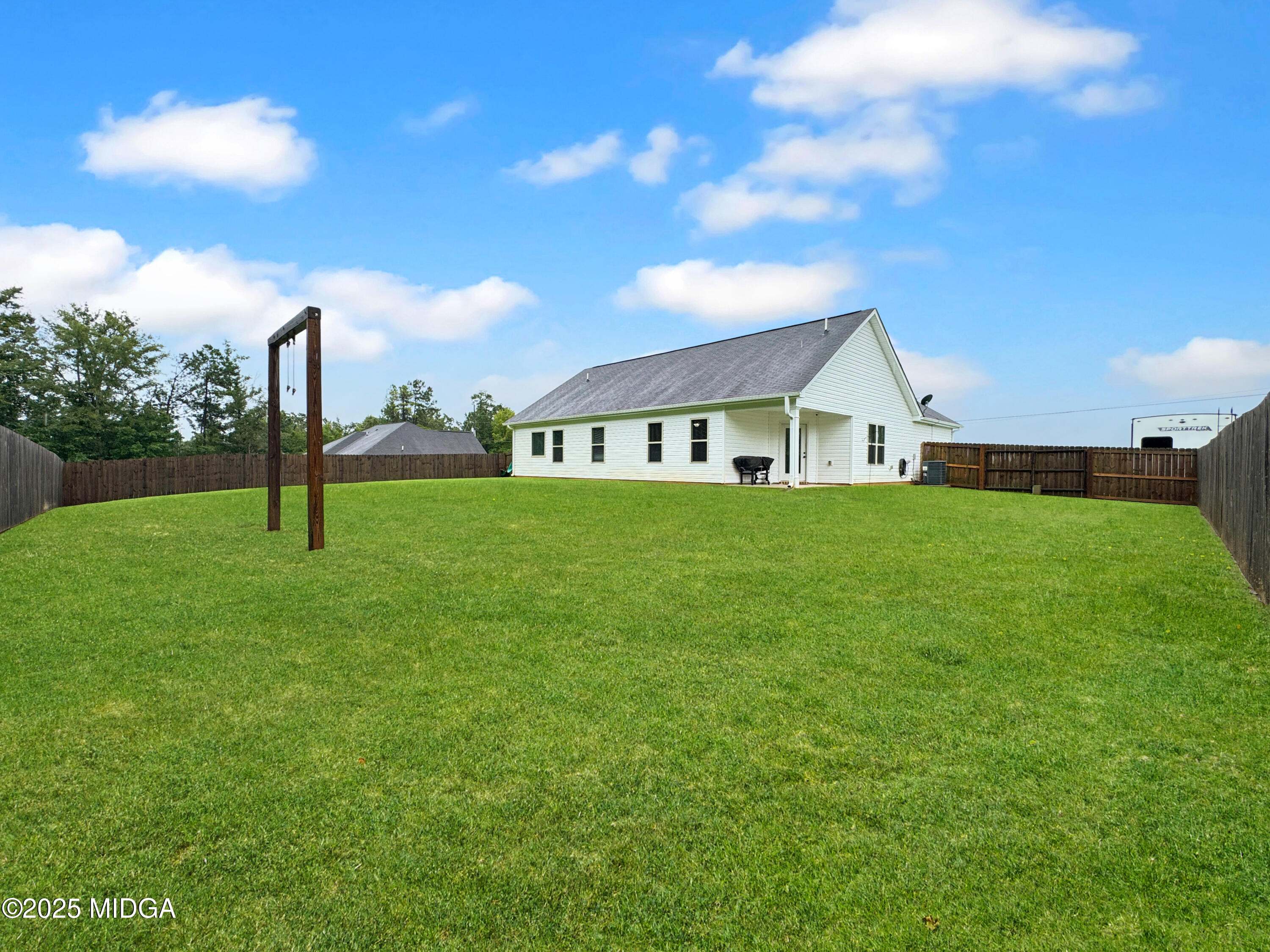 837 Weldon Road Forsyth, GA 31029 - Photo 21 of 24 a view of a house with a yard and sitting area