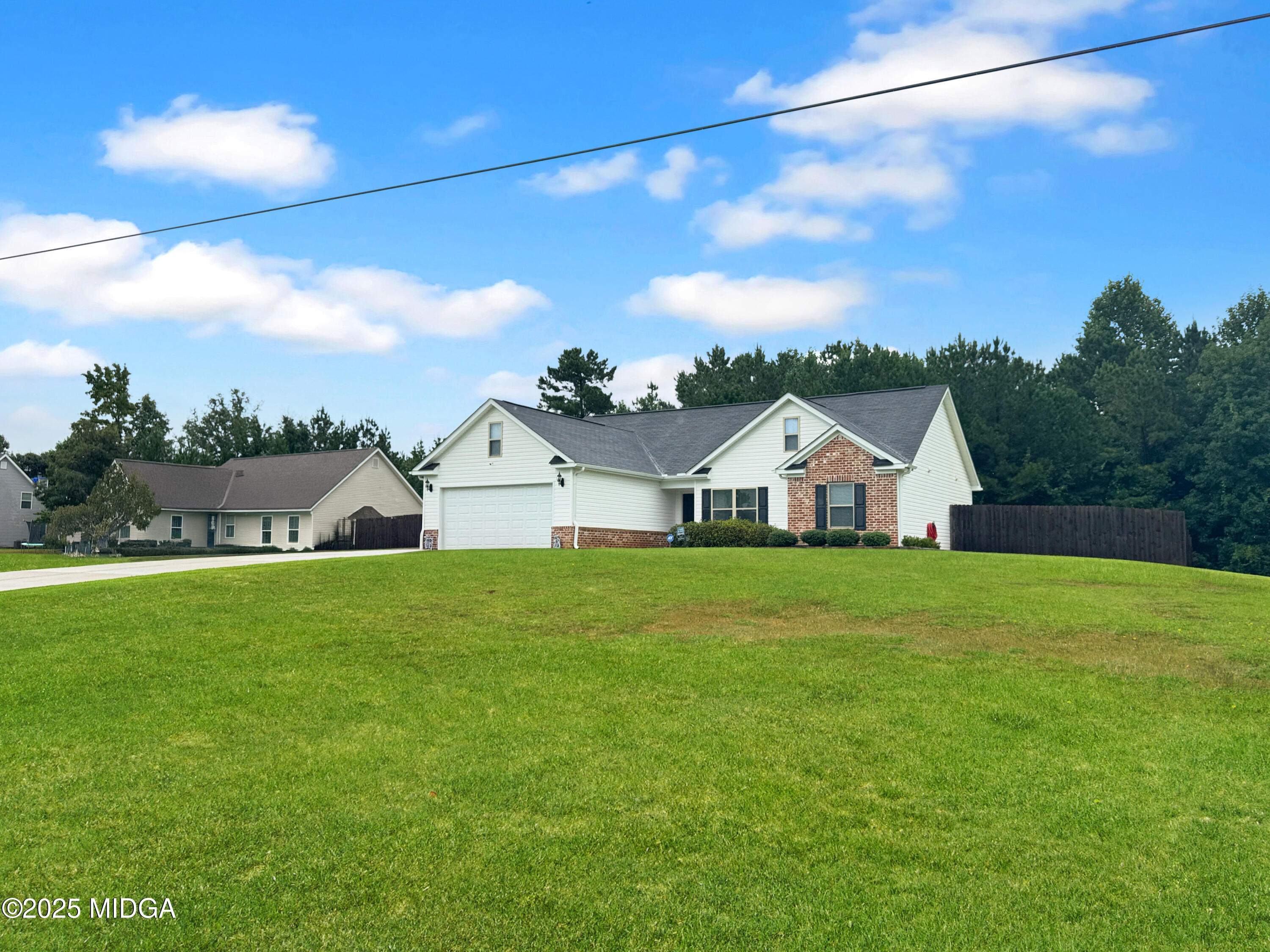 837 Weldon Road Forsyth, GA 31029 - Photo 23 of 24 a front view of a house with a yard