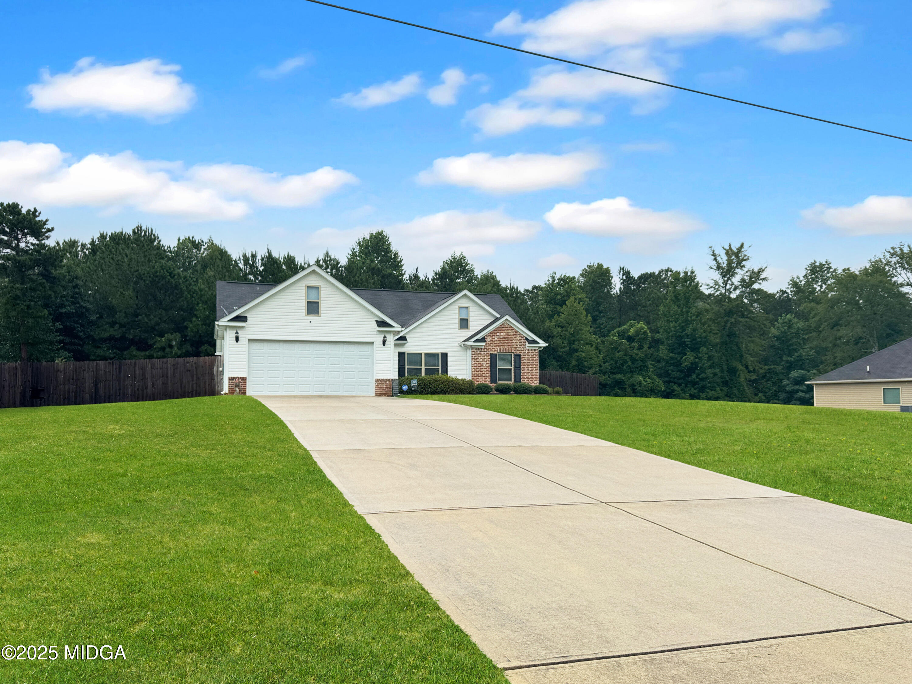 837 Weldon Road Forsyth, GA 31029 - Photo 24 of 24 a view of an house with backyard space and garden