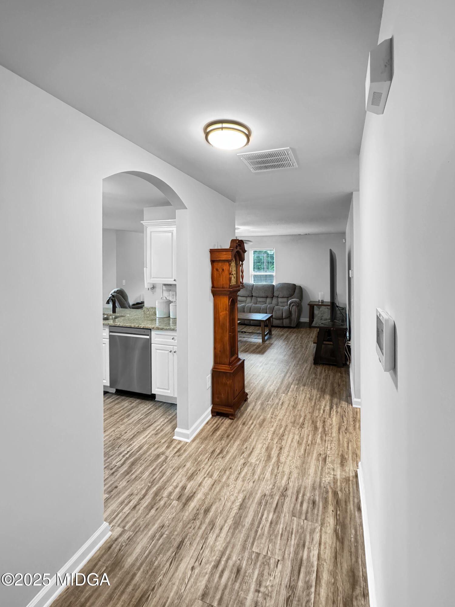 837 Weldon Road Forsyth, GA 31029 - Photo 3 of 24 a kitchen with a refrigerator and a sink