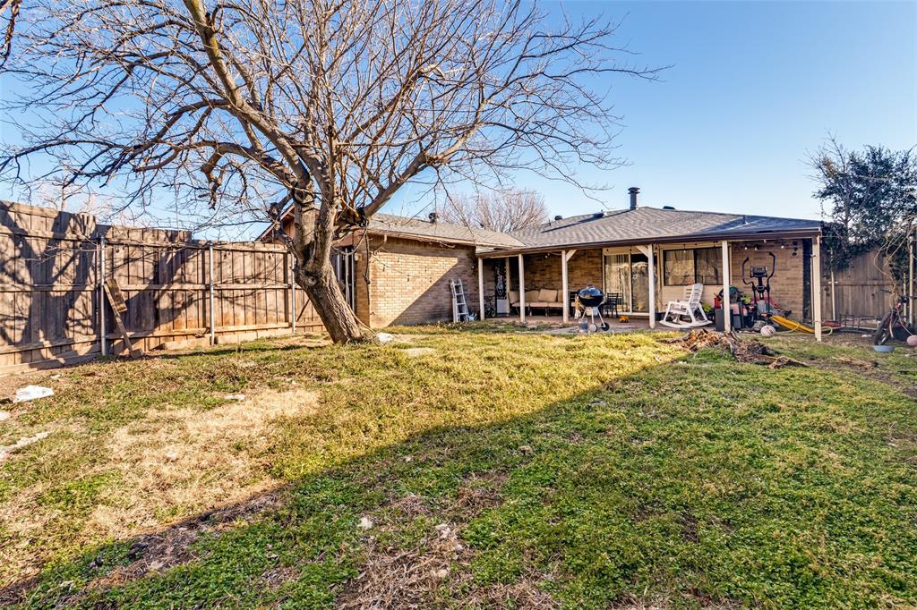 5610 Magnolia Lane Rowlett, TX 75089 - Photo 24 of 25 a view of a house with a yard