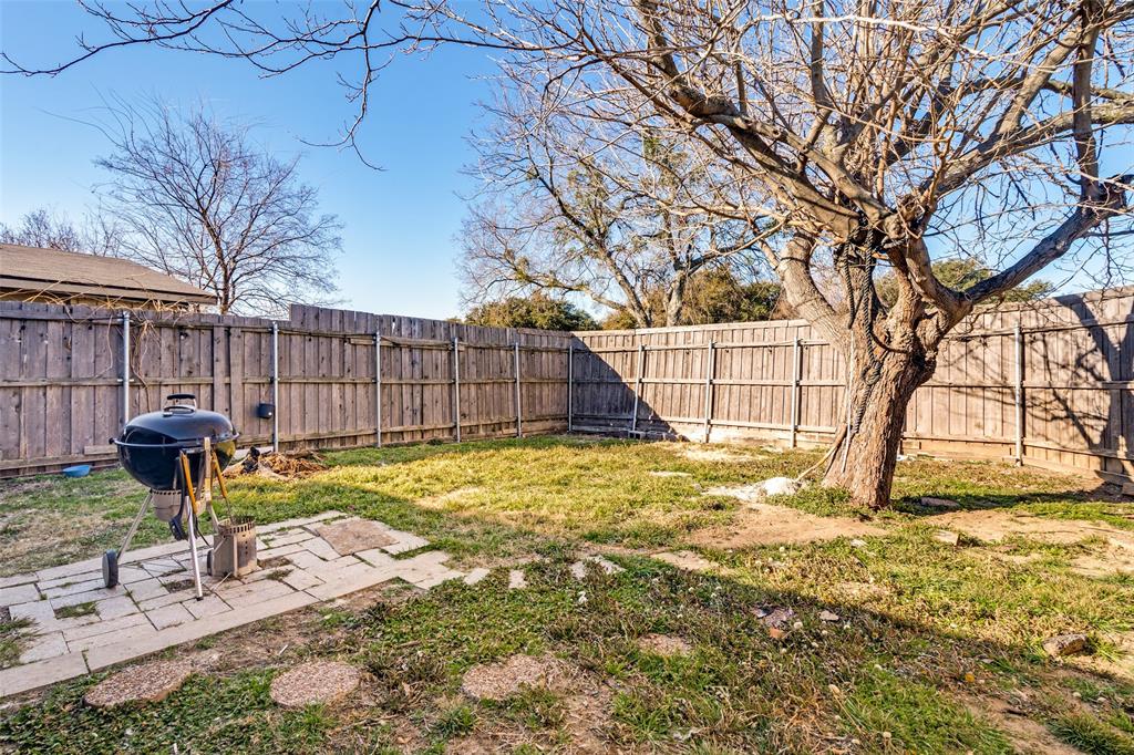 5610 Magnolia Lane Rowlett, TX 75089 - Photo 25 of 25 a view of a yard with a house and a tree