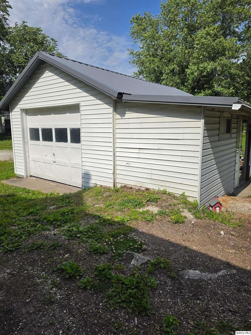 304 West 3rd Street Golden, IL 62339 - Photo 17 of 18 a view of a house with a yard