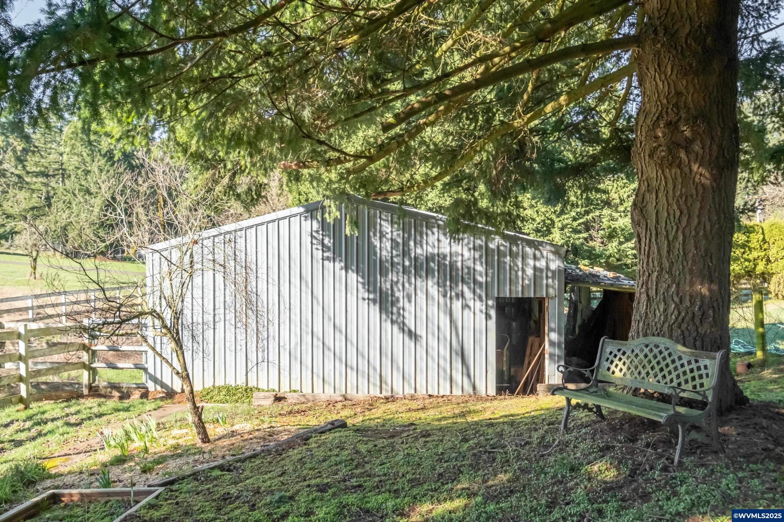 434 Rees Hill Road Southeast Salem, OR 97306 - Photo 6 of 35 a view of backyard with wooden fence and a large tree