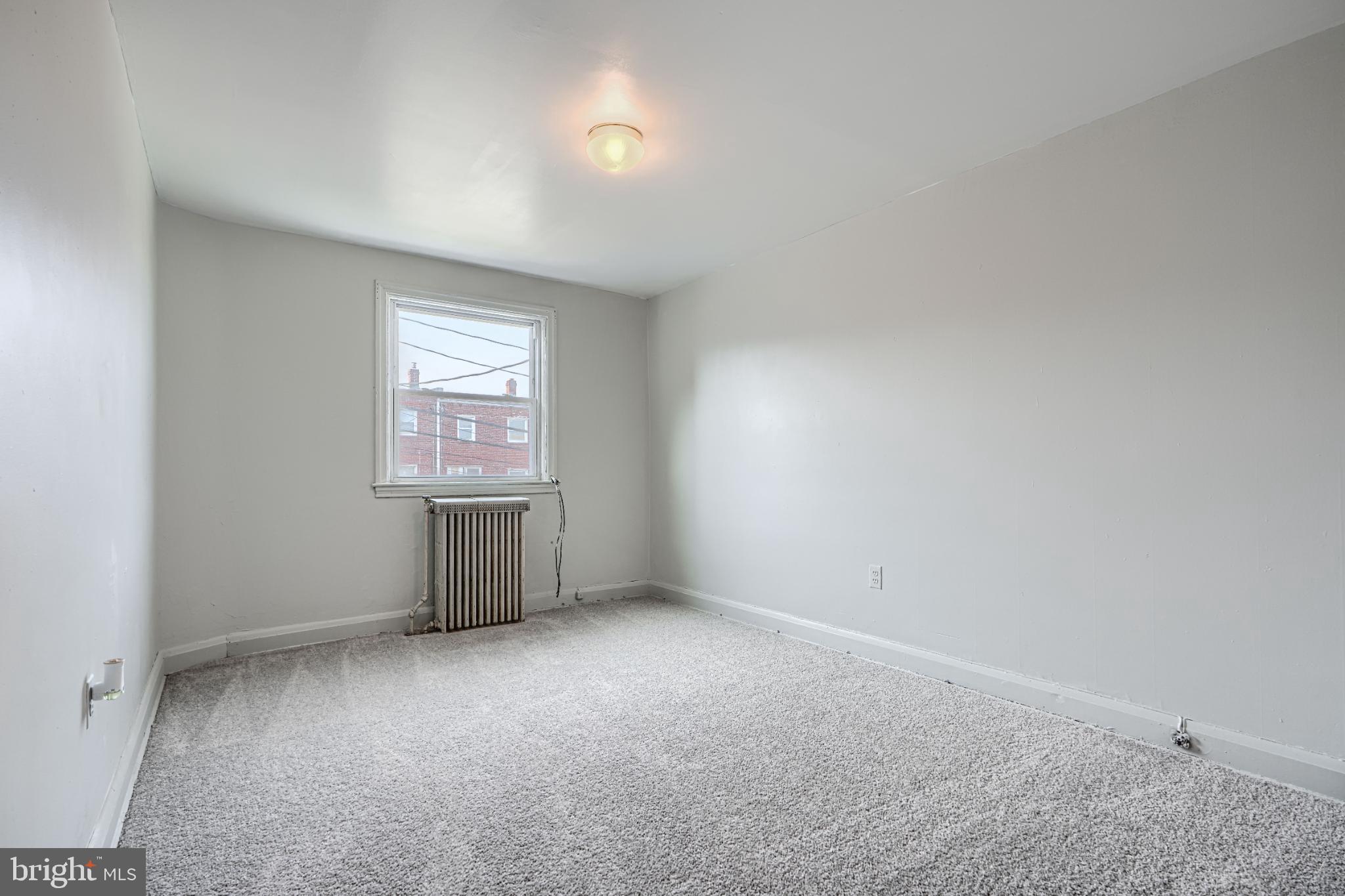 1302 Edison Highway Baltimore, MD 21213 - Photo 14 of 27 an empty room with windows