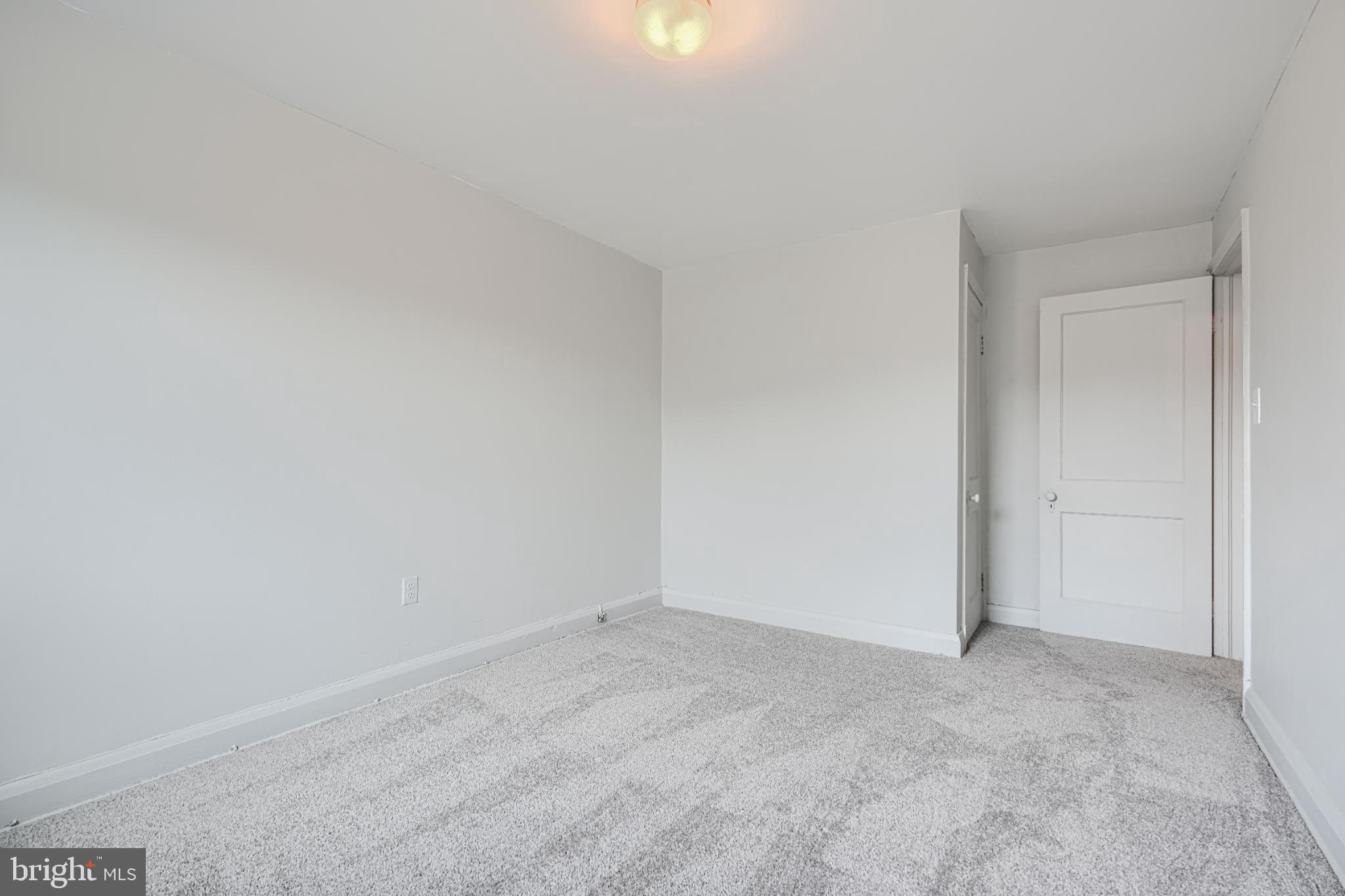 1302 Edison Highway Baltimore, MD 21213 - Photo 15 of 27 a view of an empty room and chandelier fan