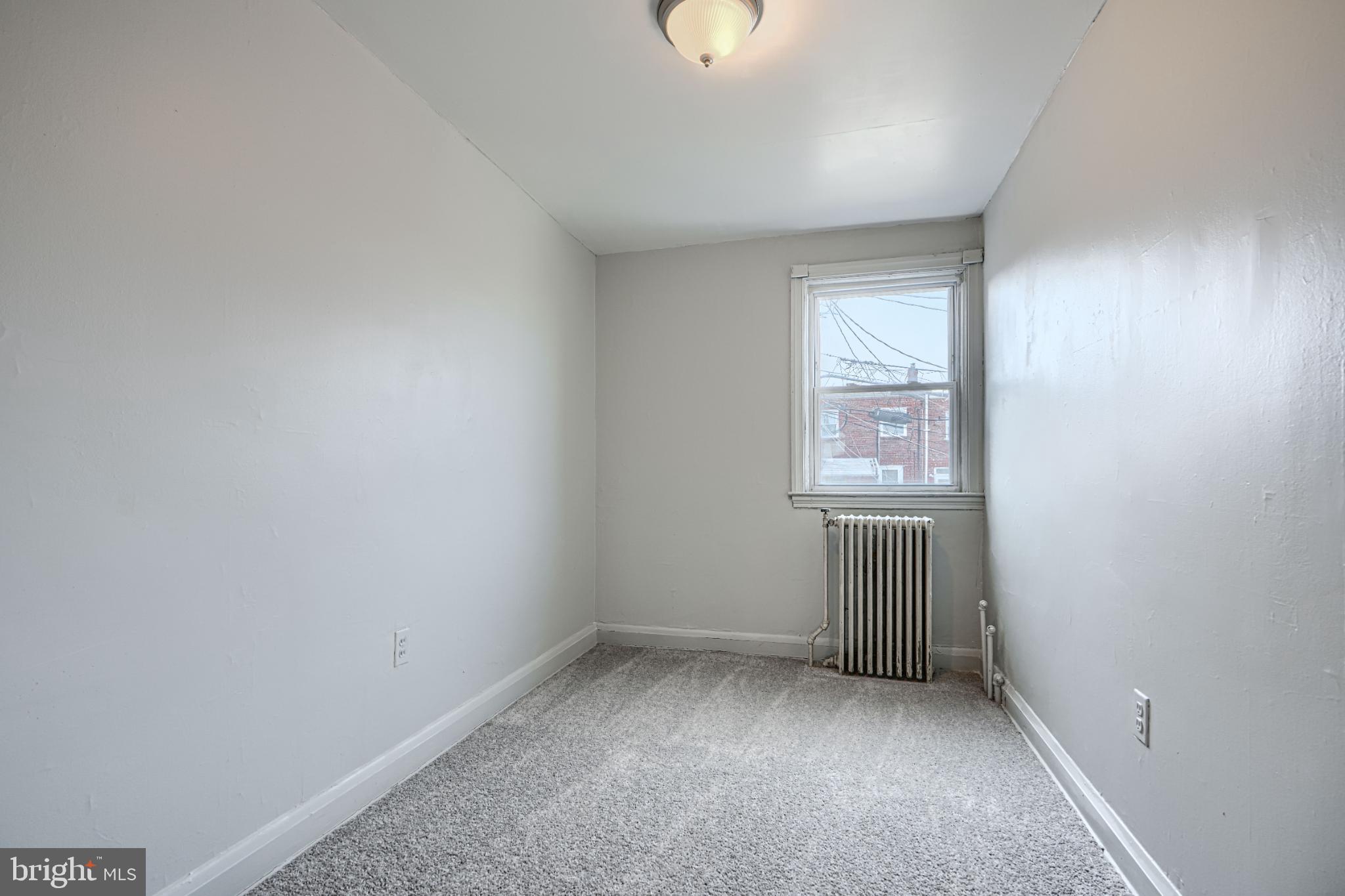 1302 Edison Highway Baltimore, MD 21213 - Photo 16 of 27 an empty room with windows