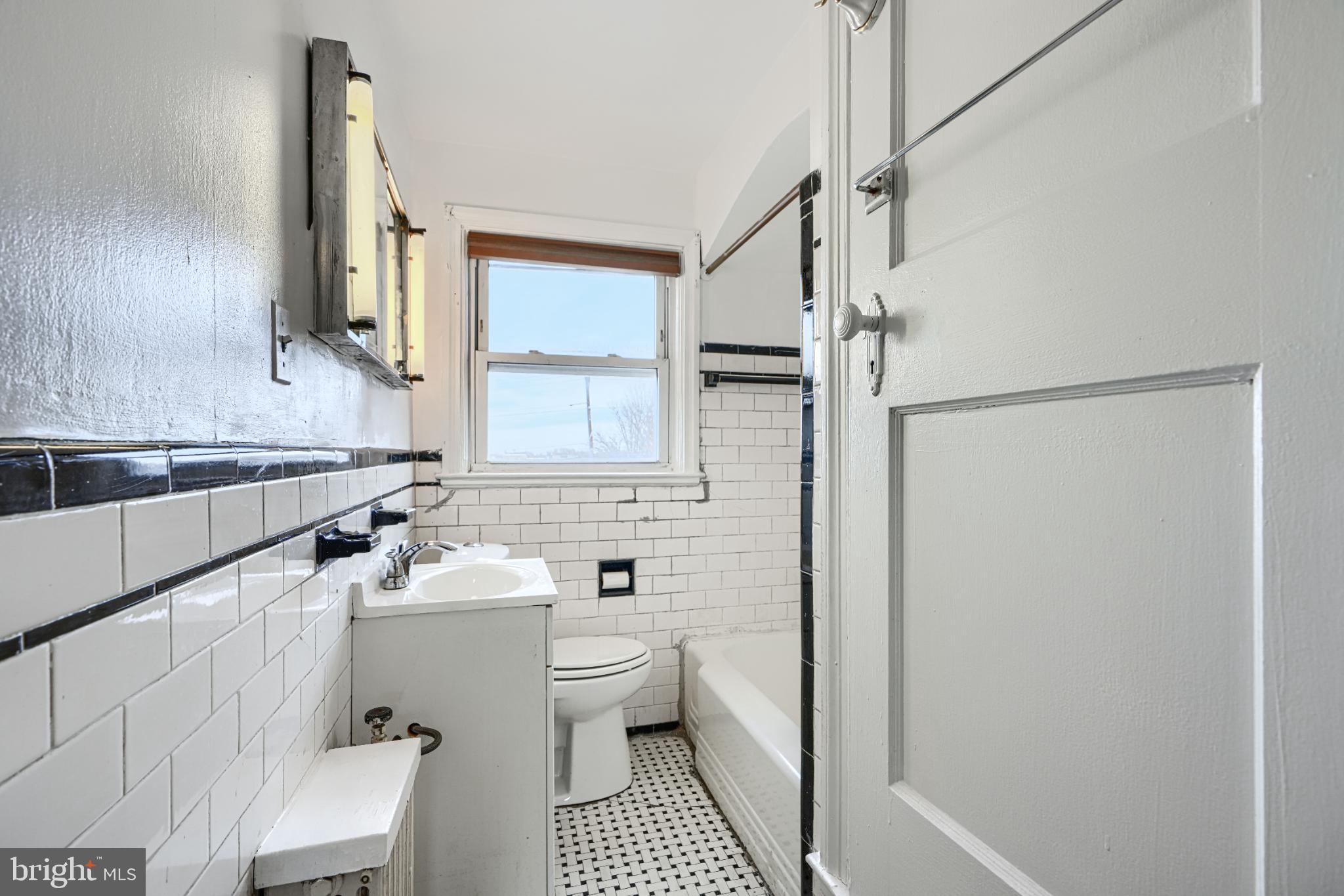 1302 Edison Highway Baltimore, MD 21213 - Photo 18 of 27 a bathroom with a sink toilet and shower