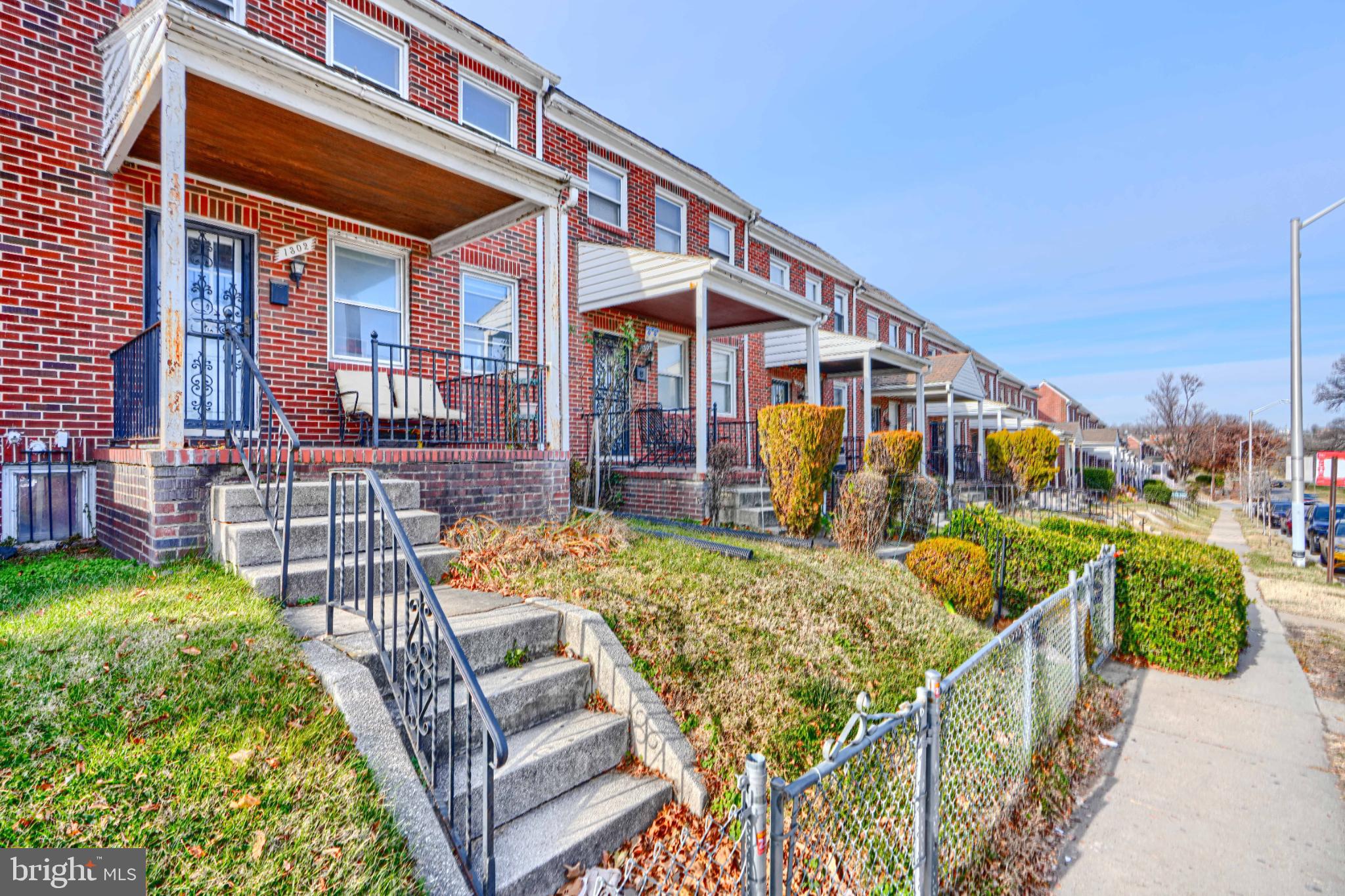 1302 Edison Highway Baltimore, MD 21213 - Photo 2 of 27 front view of a house with a yard