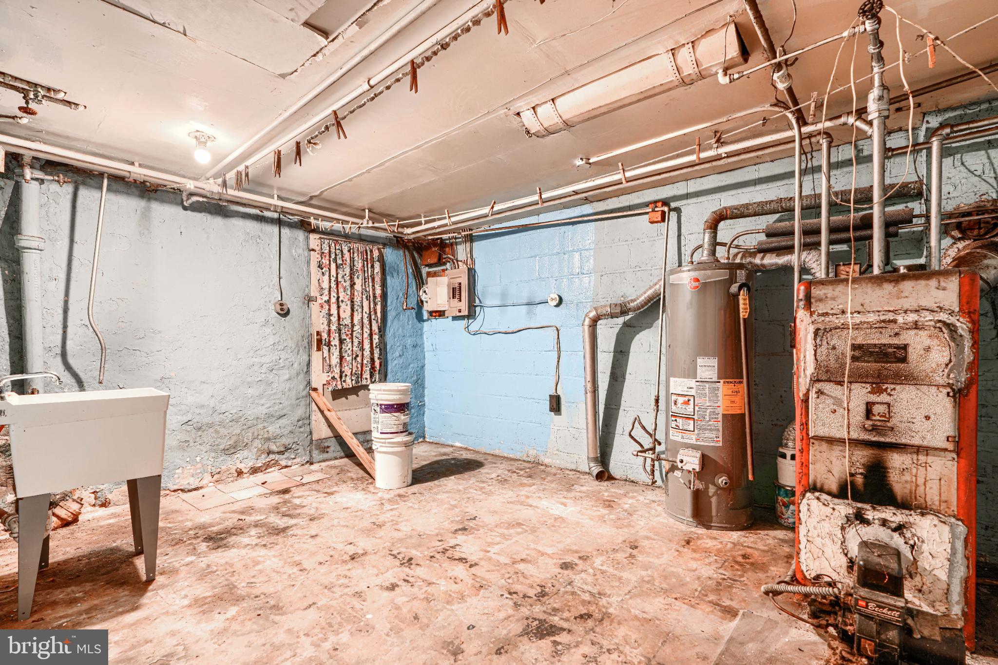 1302 Edison Highway Baltimore, MD 21213 - Photo 22 of 27 a view of walk in closet with clothes and shoes