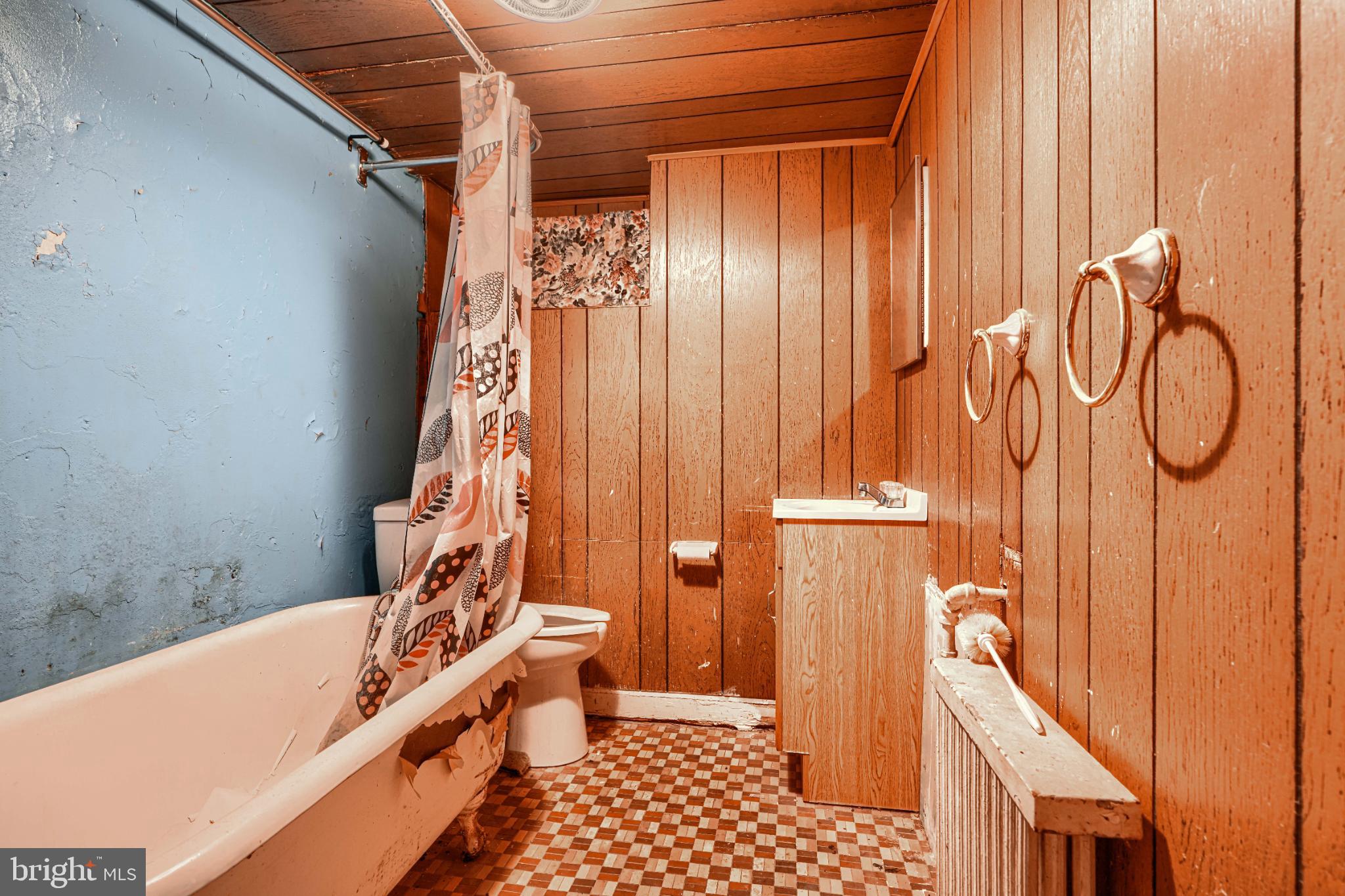 1302 Edison Highway Baltimore, MD 21213 - Photo 24 of 27 a bathroom with a bathtub and shower