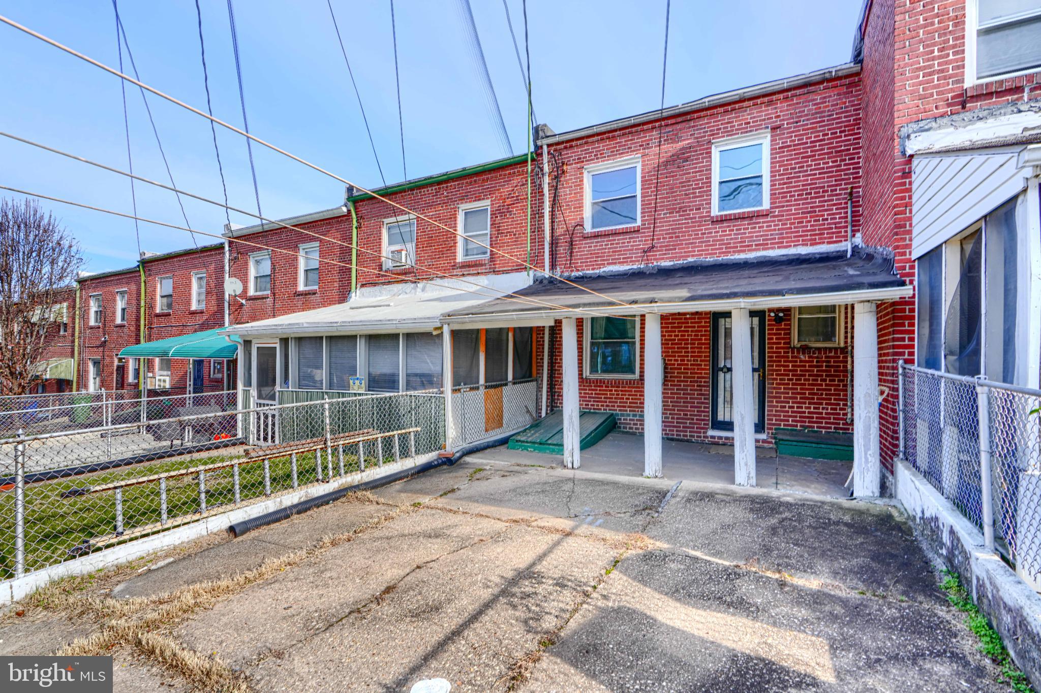 1302 Edison Highway Baltimore, MD 21213 - Photo 27 of 27 a front view of a building with a garden