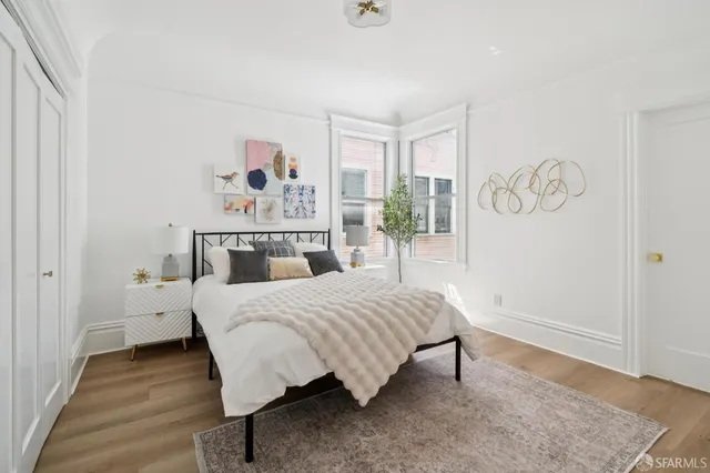 a bedroom with a bed and window