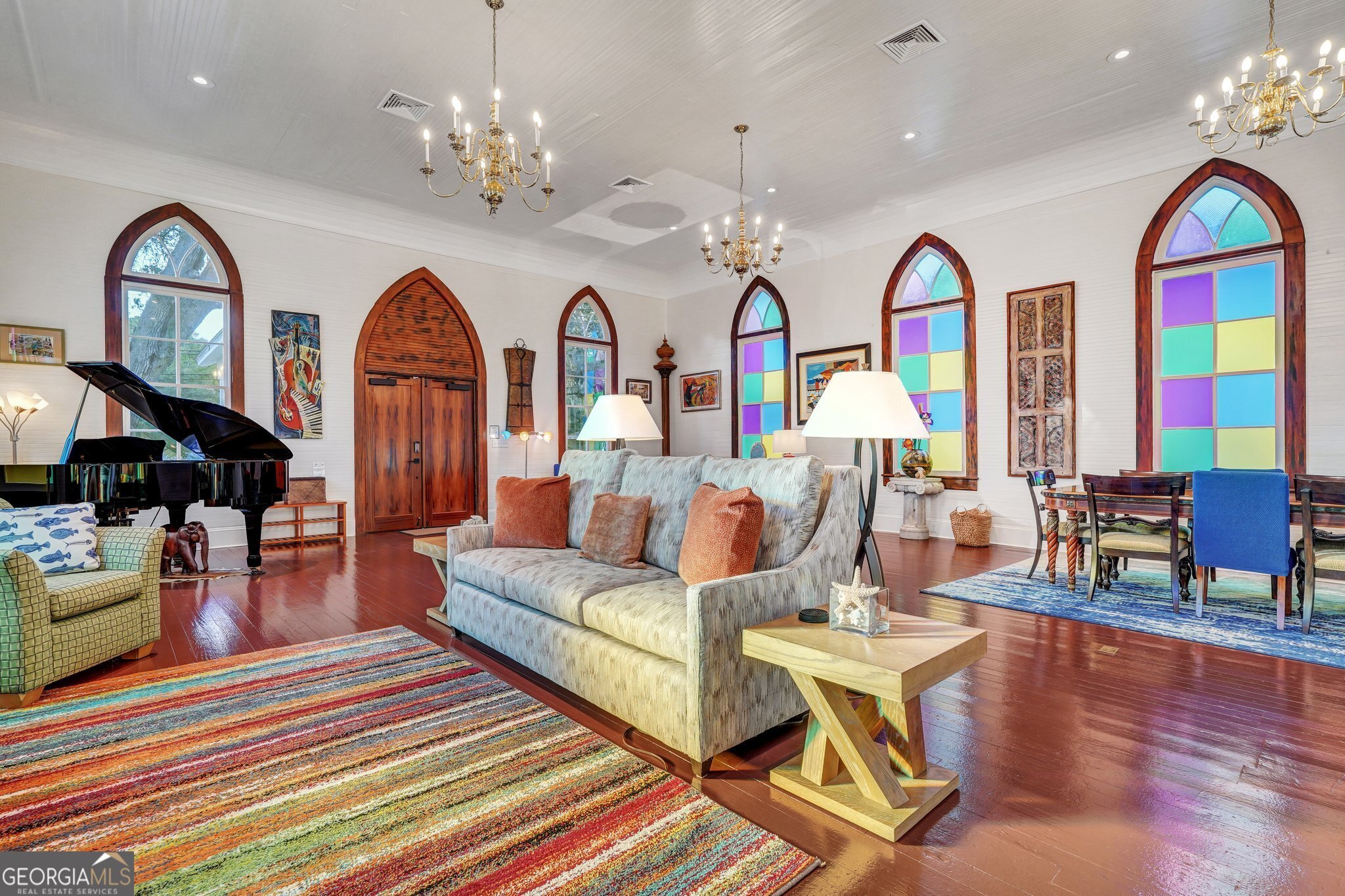 2716 Mechanics Avenue Thunderbolt, GA 31404 - Photo 14 of 50 a living room with fireplace chandelier and wooden floor