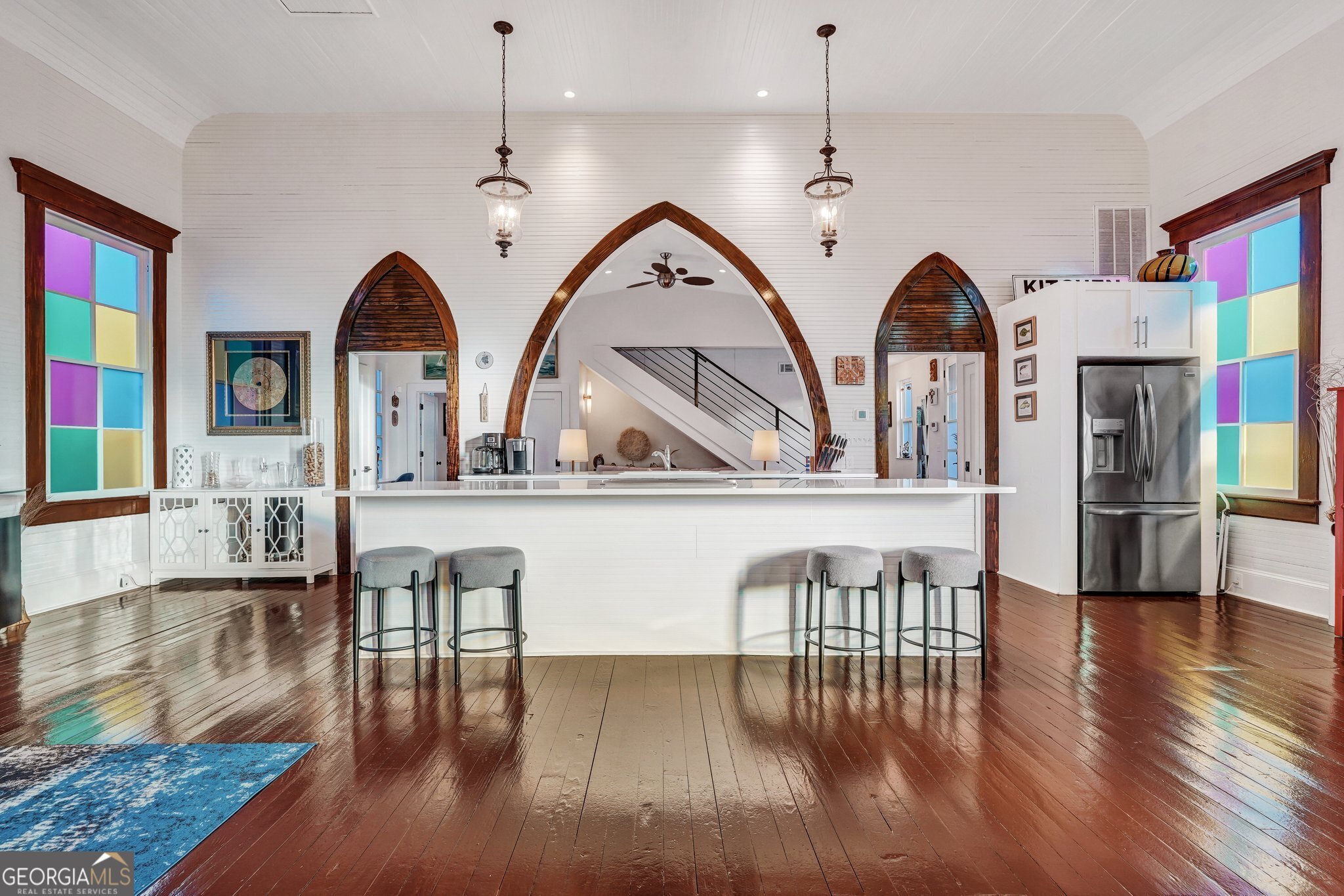 2716 Mechanics Avenue Thunderbolt, GA 31404 - Photo 19 of 50 a view of living room and dining room with furniture wooden floor