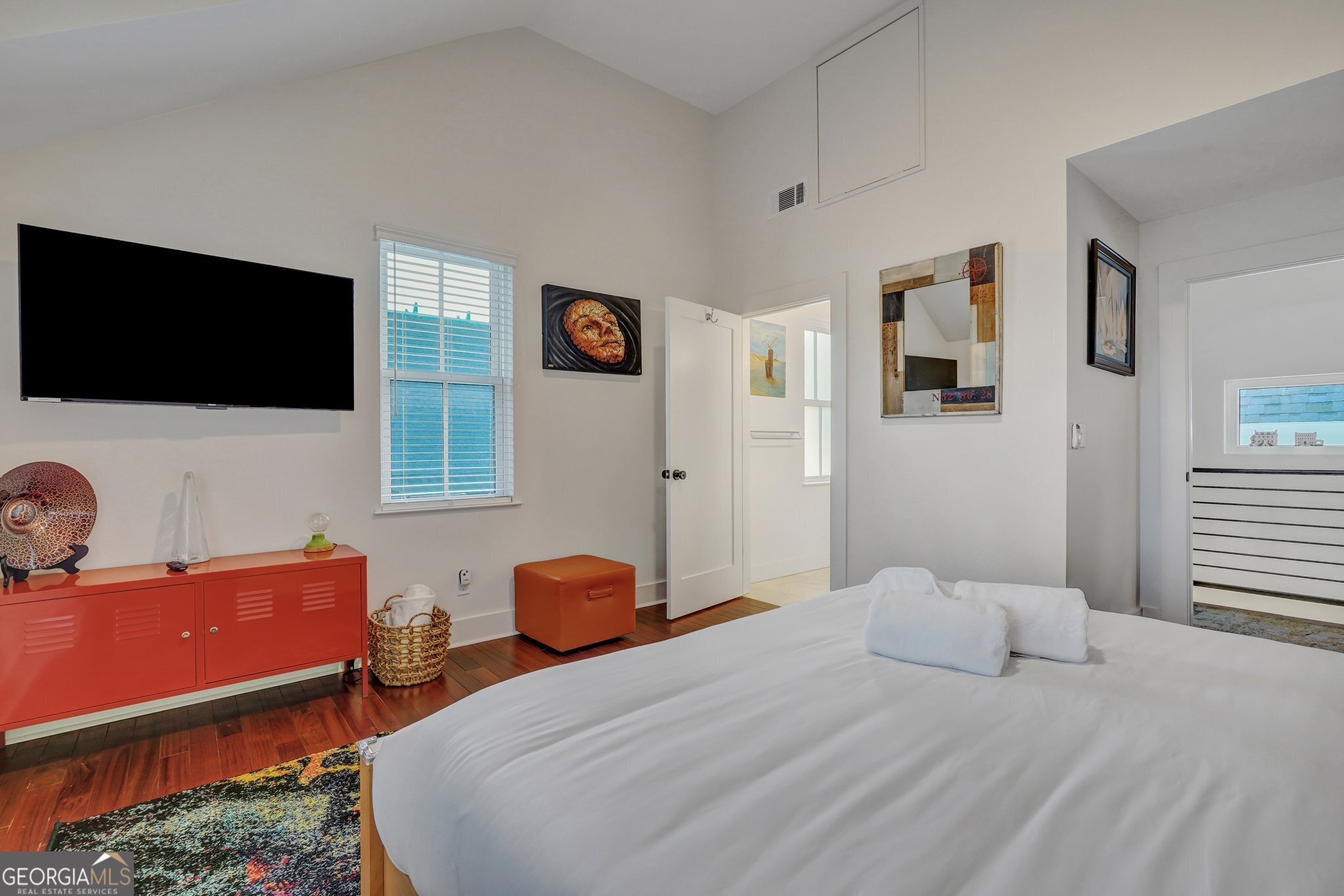 2716 Mechanics Avenue Thunderbolt, GA 31404 - Photo 38 of 50 a bedroom with a bed and a flat screen tv