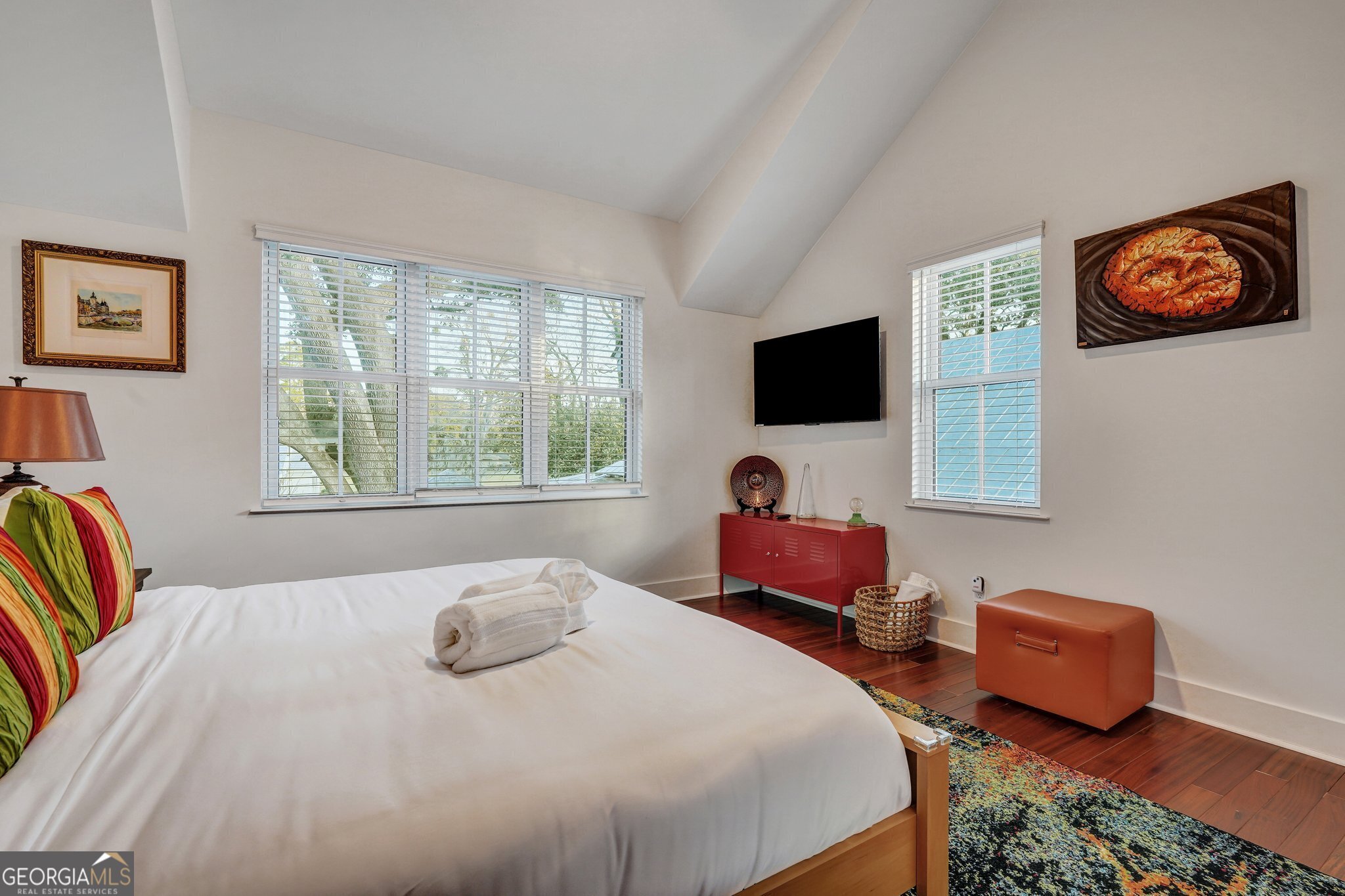 2716 Mechanics Avenue Thunderbolt, GA 31404 - Photo 39 of 50 a bedroom with a bed and a flat screen tv