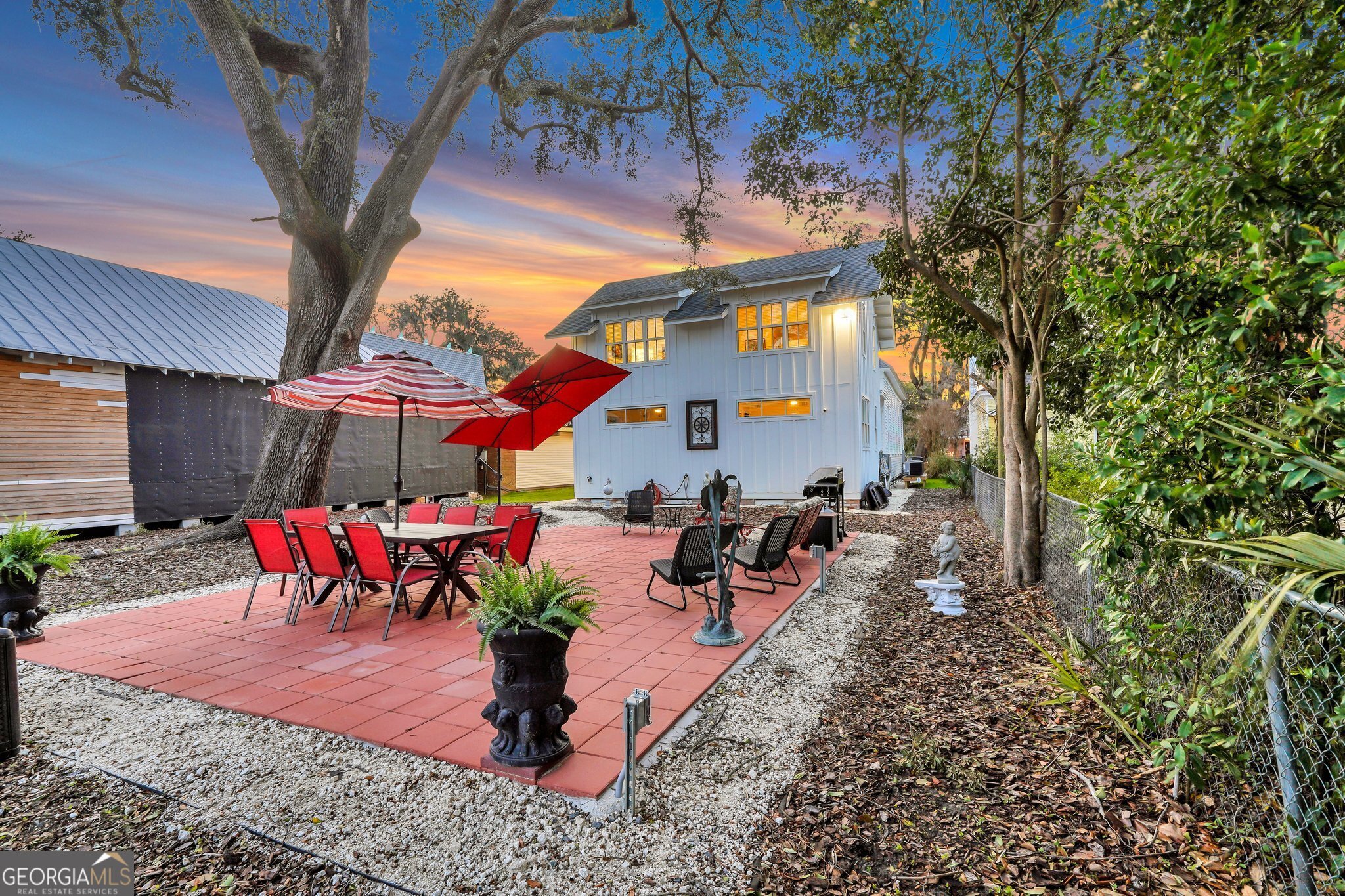 2716 Mechanics Avenue Thunderbolt, GA 31404 - Photo 44 of 50 a view of a patio with table and chairs potted plants
