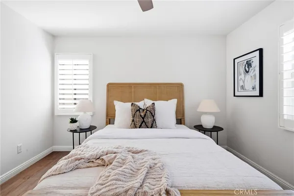 a bedroom with a bed and a night stand