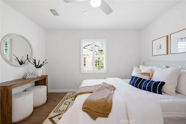 a bedroom with bed and a window
