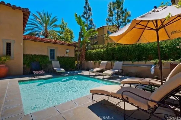 a view of a backyard with sitting area