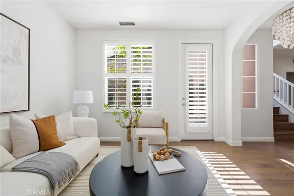 a living room with furniture and a large window
