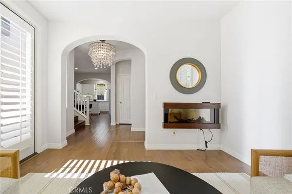 a view of a livingroom with furniture and bathroom