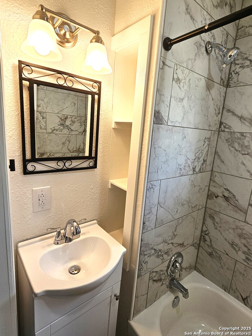105 Santa Clara Street Cibolo, TX 78108 - Photo 17 of 35 a bathroom with a sink and mirror with toilet