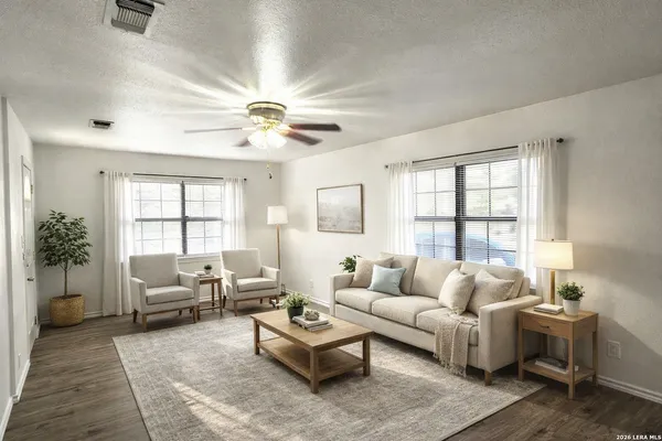 a living room with furniture and a large window